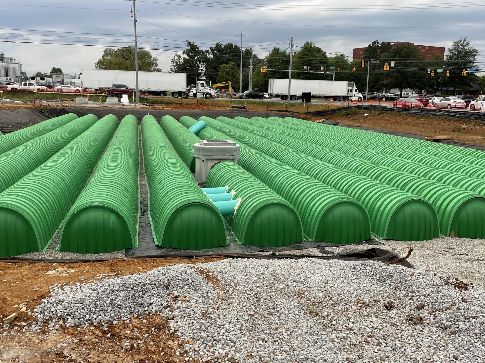 Underground stormwater detention chambers installed with stone backfill, PMT Site project