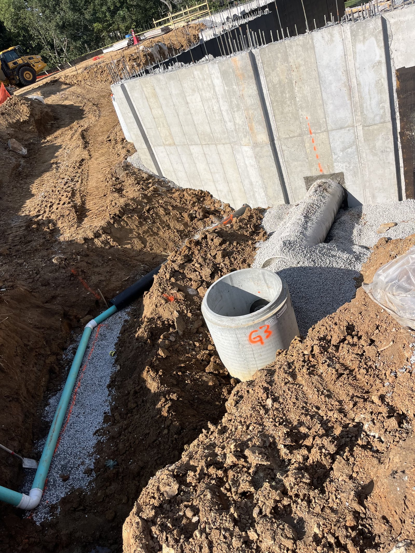PMT Site crew relocating utilities and resolving conflicts around existing infrastructure