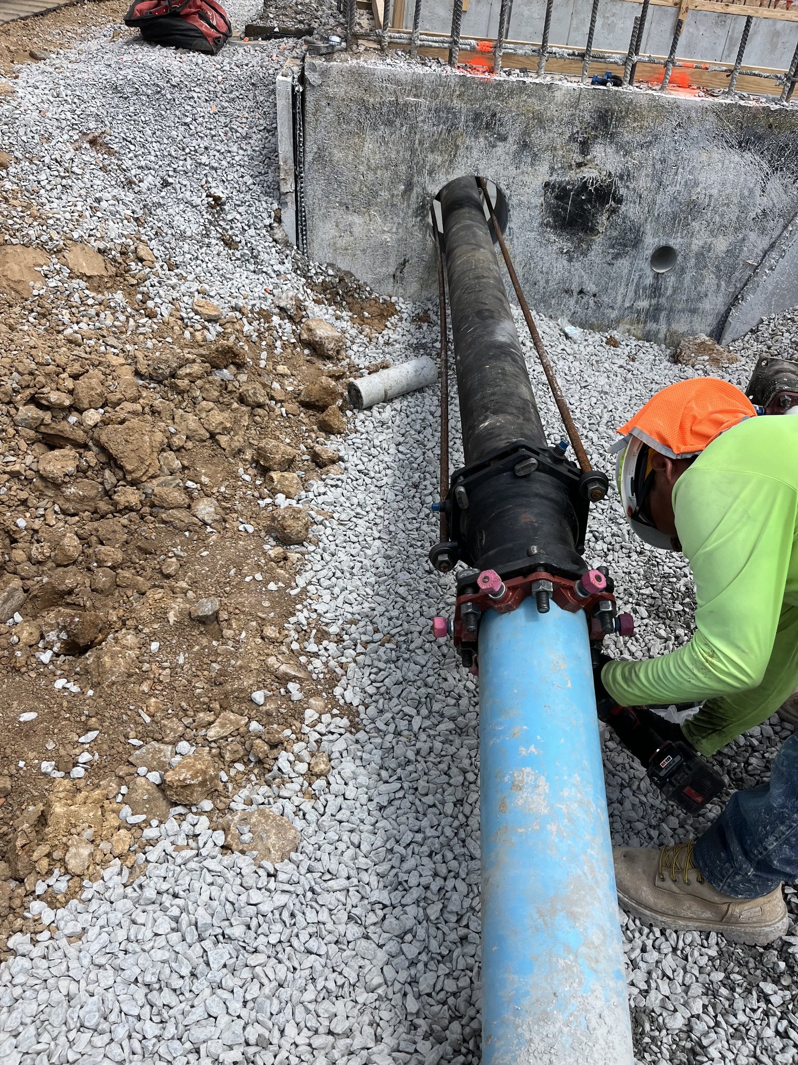 PMT Site worker connecting a new water main line
